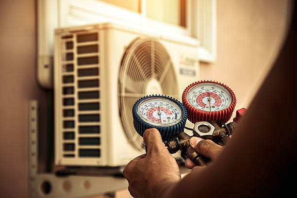 Professional Heat Pump Repair technician working in Grand View, ID